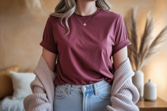 Woman wearing maroon t shirt and jeans image Product Image 1