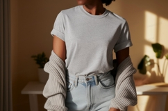 Woman wearing grey t shirt and denim jeans image Product Image 1