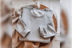 Gray Tshirt Mockup On Wooden Surface Product Image 1