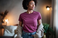 Woman wearing plum t shirt and denim jeans Product Image 1