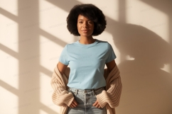 Woman wearing light blue t shirt and beige cardigan Product Image 1