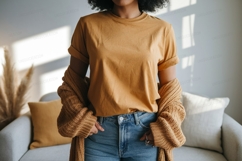 Woman wearing mustard t shirt and denim jeans image Product Image 1