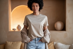 Woman wearing beige t shirt and blue jeans image Product Image 1