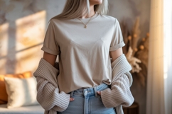 Woman wearing beige t shirt and blue jeans image Product Image 1