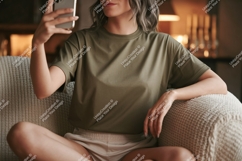 Woman holding phone taking selfie on couch home Product Image 1