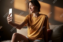 Woman taking selfie with phone indoor couch Product Image 1