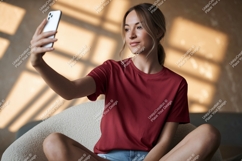 Woman taking selfie in maroon tee phone t-shirt Product Image 1