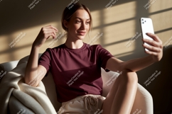 Woman taking selfie wearing maroon t shirt and shorts Product Image 1