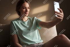 Woman taking selfie on sofa phone casual Product Image 1