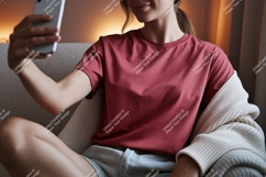 Woman wearing red t-shirt taking selfie Product Image 1