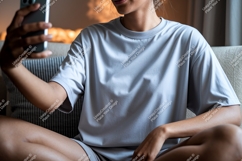 Woman wearing grey t shirt taking selfie phone Product Image 1