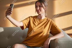 Woman taking selfie on couch phone casual Product Image 1