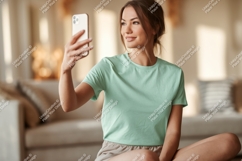 Woman taking selfie with phone indoor casual Product Image 1