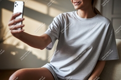 Woman taking selfie in casual wear phone grey Product Image 1