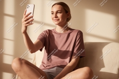 Young woman taking selfie on couch phone indoor Product Image 1