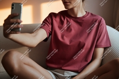 Woman taking selfie wearing maroon t shirt phone Product Image 1
