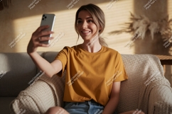 Woman taking selfie on couch phone casual Product Image 1