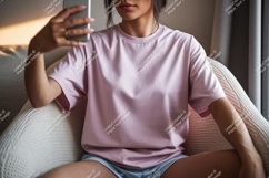 Woman wearing pink shirt taking selfie phone Product Image 1