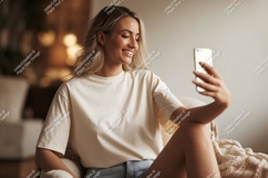 Woman taking selfie on phone indoor casual Product Image 1