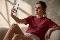Woman taking selfie with phone couch casual Product Image 1