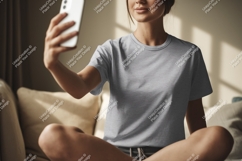 Woman taking selfie wearing grey t shirt phone Product Image 1