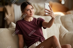 Woman taking selfie on couch phone casual Product Image 1
