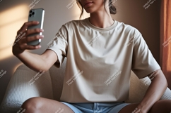 Woman taking selfie wearing beige t shirt phone Product Image 1