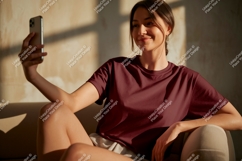 Woman taking selfie wearing maroon t shirt phone Product Image 1