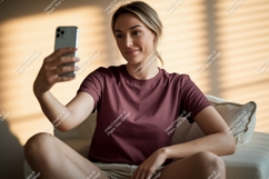 Woman taking selfie with phone casual indoor Product Image 1