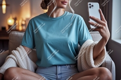 Woman wearing blue t shirt holding phone image Product Image 1