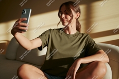 Woman taking selfie with phone couch casual Product Image 1