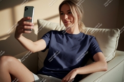 Woman taking selfie in navy shirt phone Product Image 1
