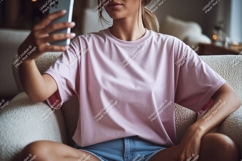 Woman taking selfie on couch phone pink Product Image 1