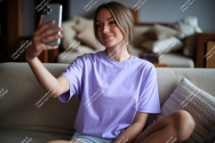 Woman taking selfie on sofa phone casual Product Image 1