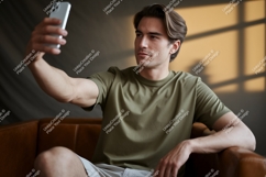 Man holding phone taking selfie technology Product Image 1