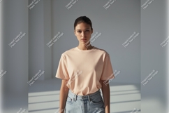Woman In Peach Tshirt Mockup In Studio Product Image 1