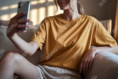 Woman taking selfie on couch phone casual Product Image 1