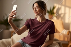Woman takes selfie wearing maroon t shirt phone Product Image 1