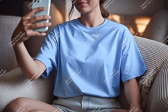 Person holding phone taking selfie blue shirt Product Image 1