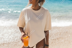 Woman holding orange drink on beach ocean Product Image 1