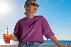 Woman holding drink wearing purple t shirt image Product Image 1
