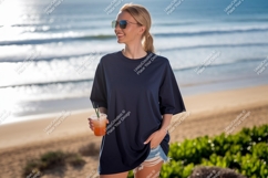 Woman wearing dark blue t shirt holding drink image Product Image 1