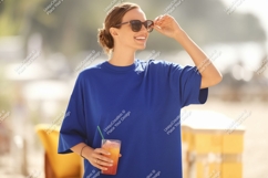 Woman blue shirt sunglasses drink image Product Image 1