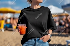 Black t shirt blue jeans holding drink image Product Image 1