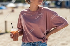 Rose shirt woman holding iced coffee image Product Image 1