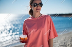 Woman wearing coral shirt holding drink sunglasses Product Image 1