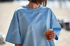 Blue oversized shirt holding drink glass Product Image 1