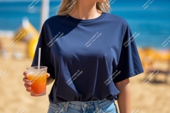 Woman wearing navy t shirt holding orange drink image Product Image 1