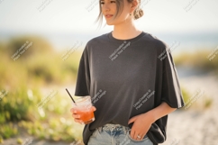 Woman holding drink at beach summer casual Product Image 1