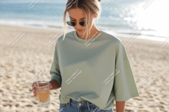 Woman holding drink on beach sunglasses casual Product Image 1